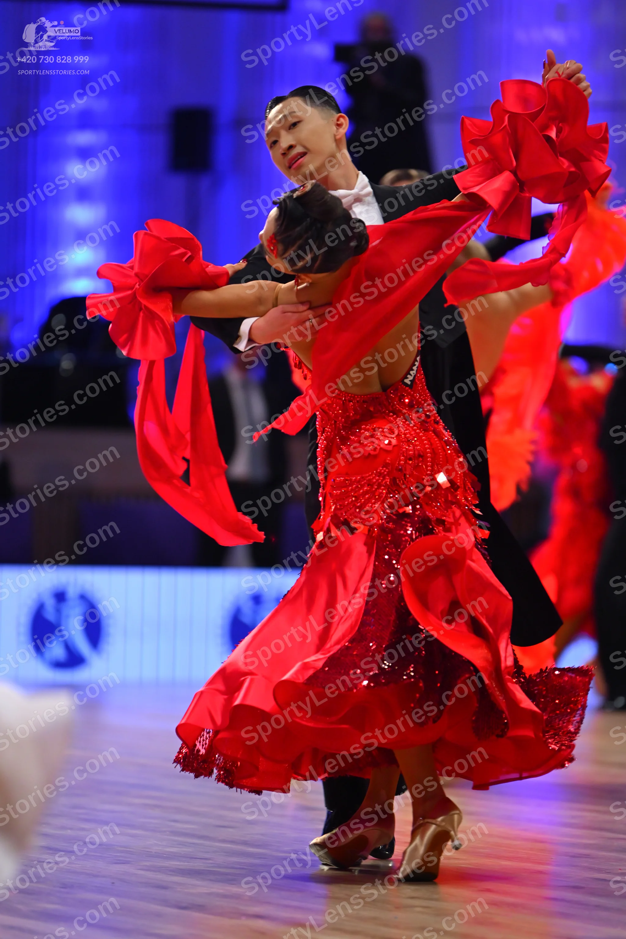 Dancesport competitor: Male dancer: black suit with a white shirt and white bowtie