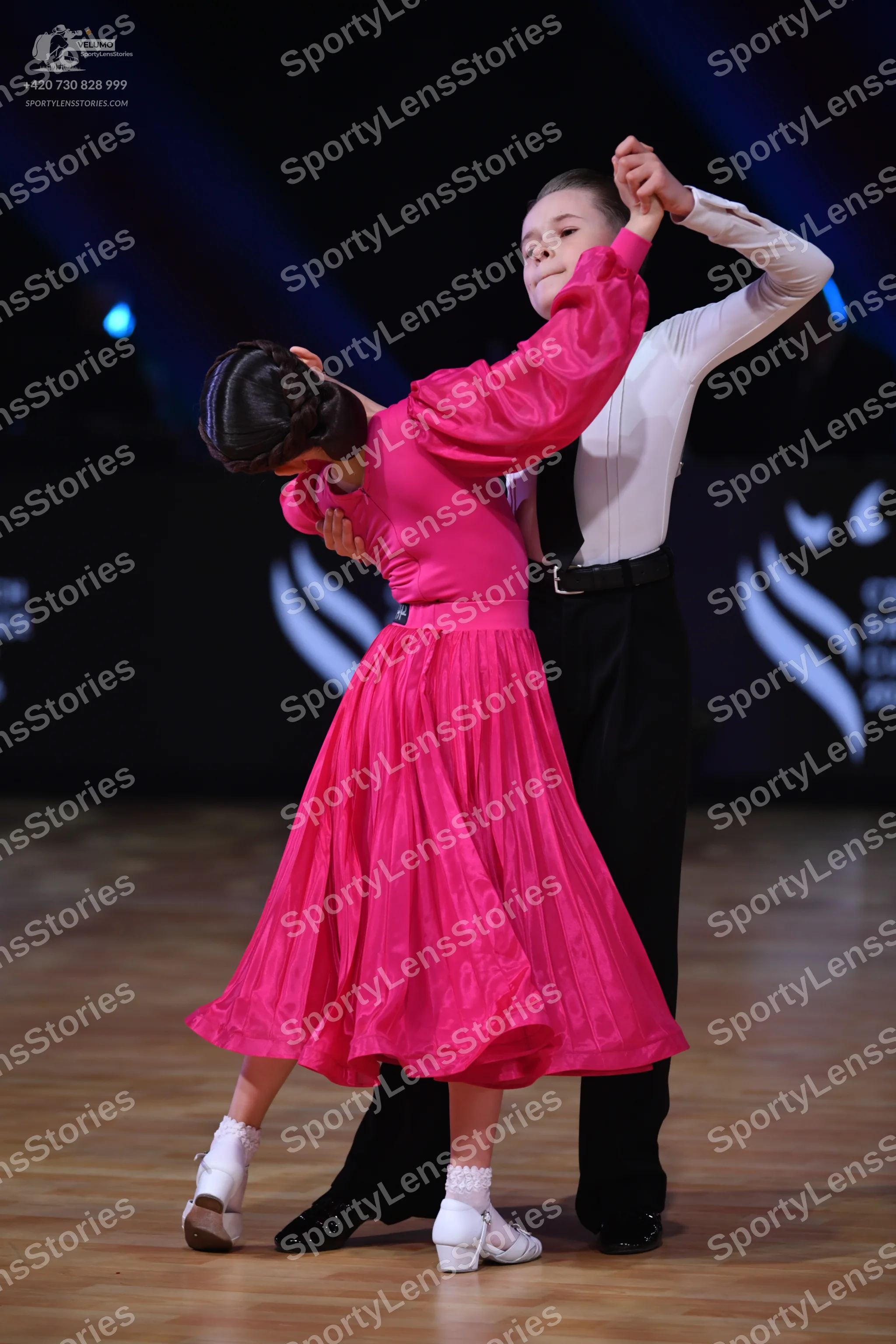 Dancesport competitor: Male dancer: white long-sleeved shirt and black trousers