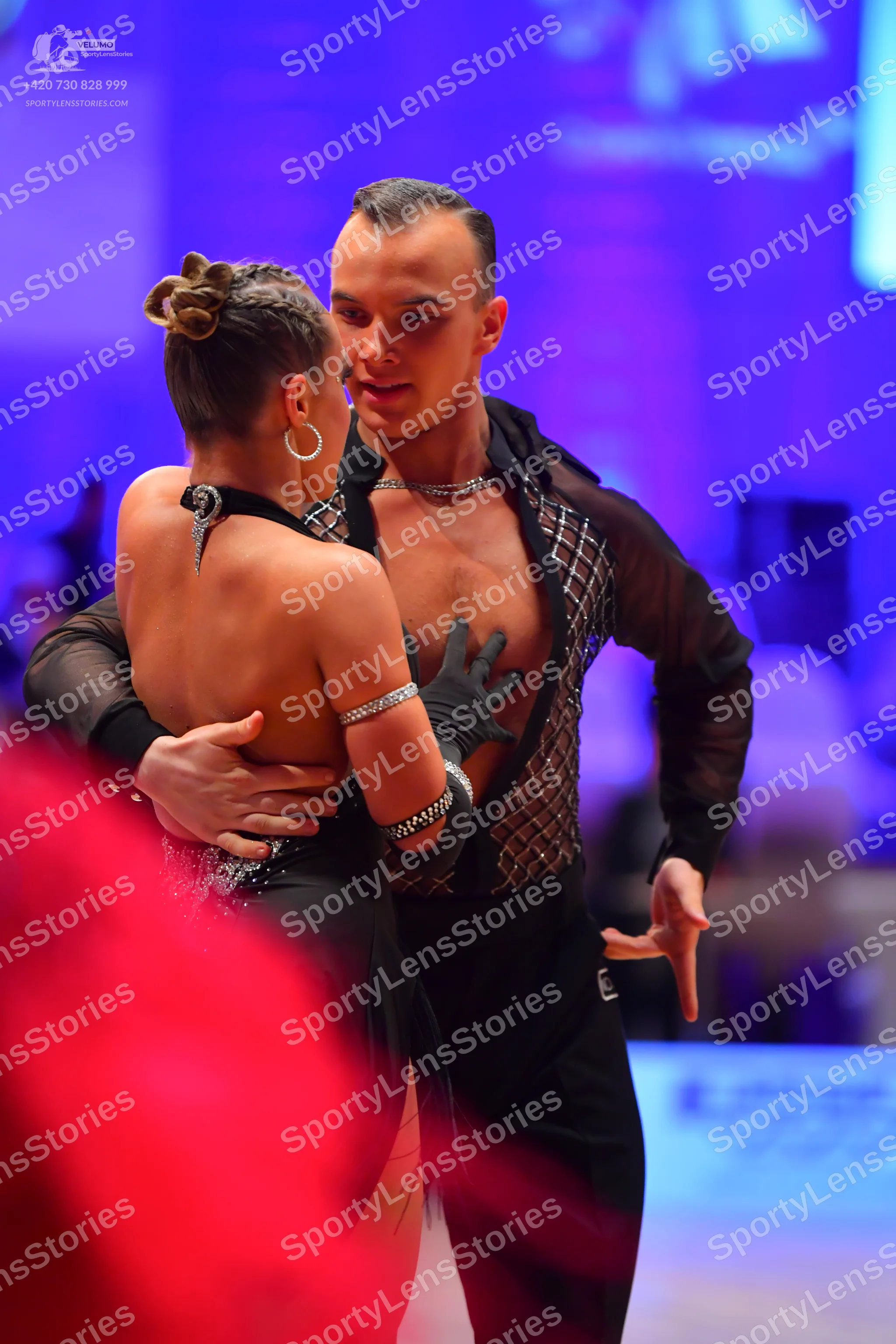 Dancesport competitor: Male dancer: black sheer long-sleeved shirt with a sequined mesh pattern on the