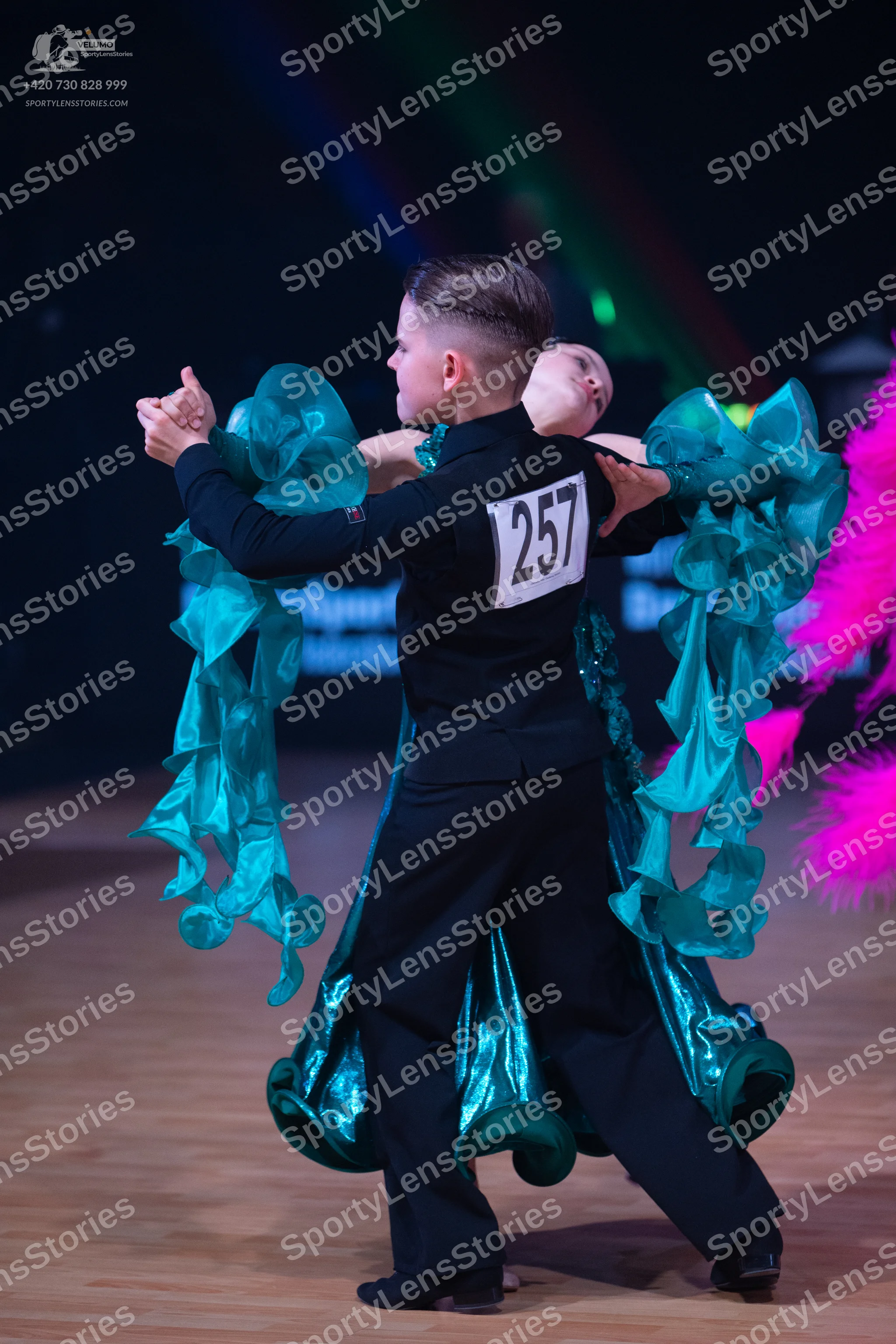 Dancesport competitor: Male dancer: black long-sleeved top and black trousers