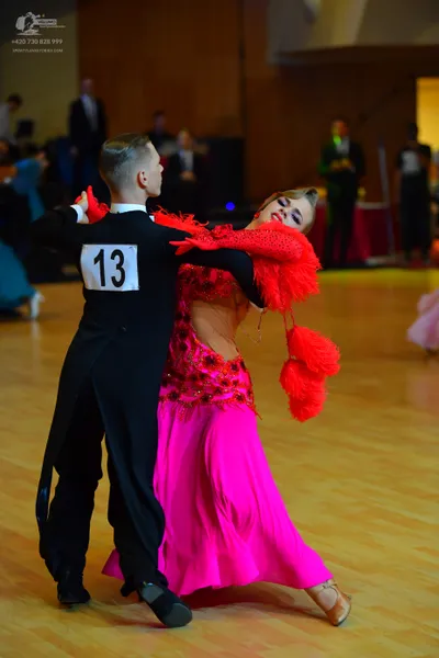 Dancesport competitor #13: Male dancer: black long-sleeved shirt and trousers