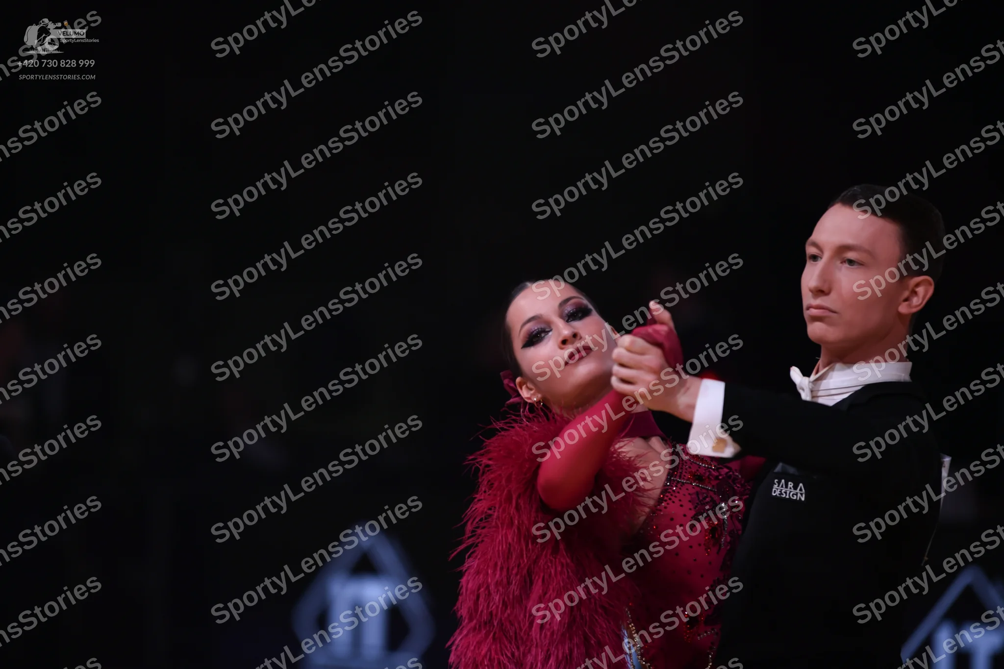 Dancesport competitor: Male dancer: black long-sleeved shirt with a white collar