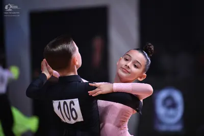 Dancesport competitor: Male dancer: black long-sleeved shirt
