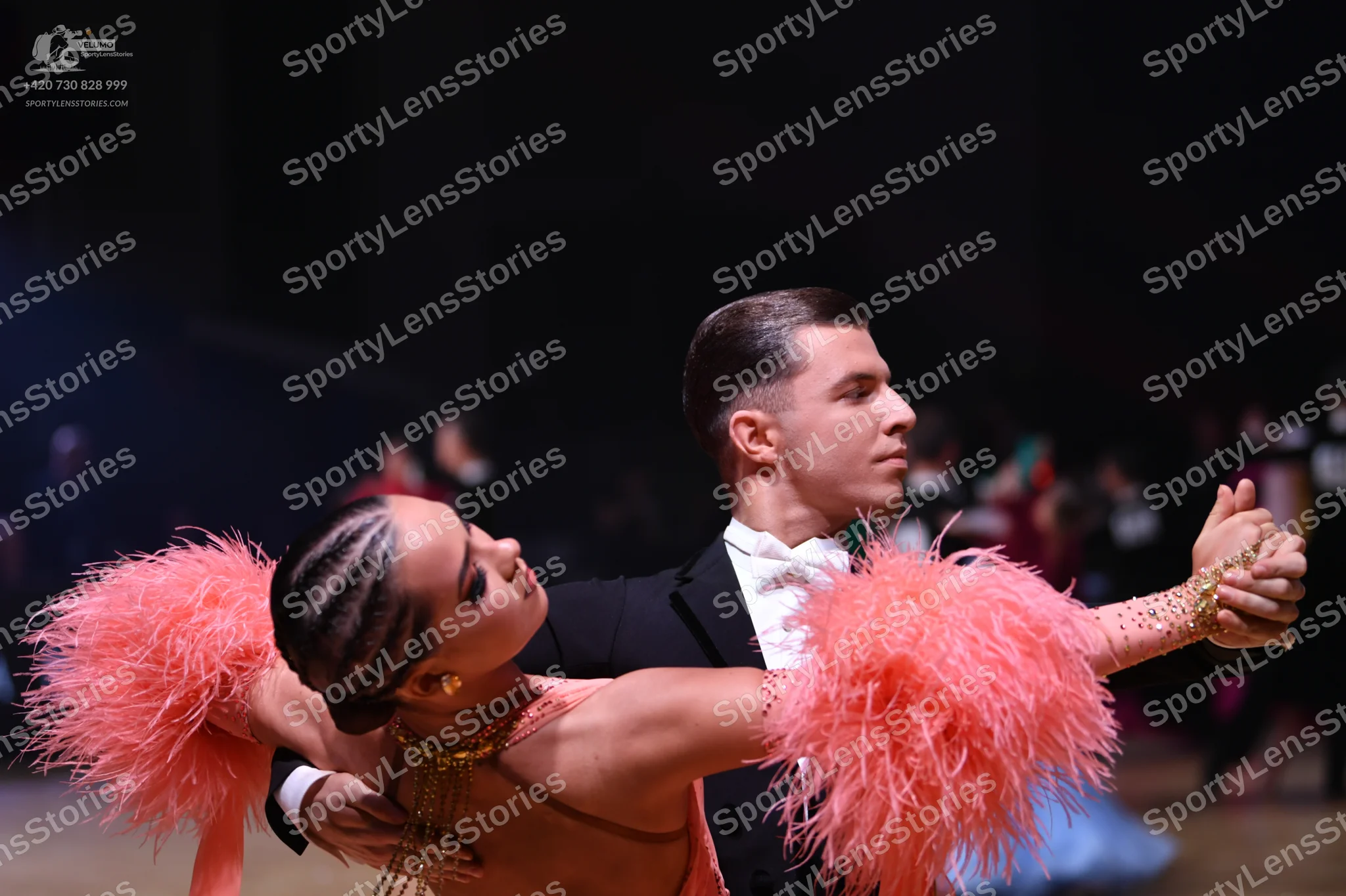 Dancesport competitor: Male dancer: black suit with a white shirt and white bowtie