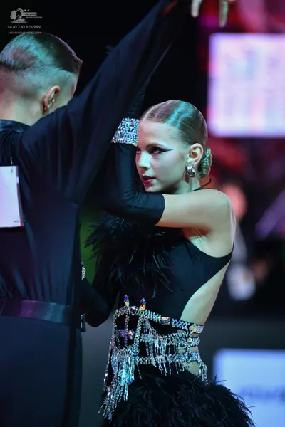 Dancesport competitor: Male dancer: black long-sleeved dance top