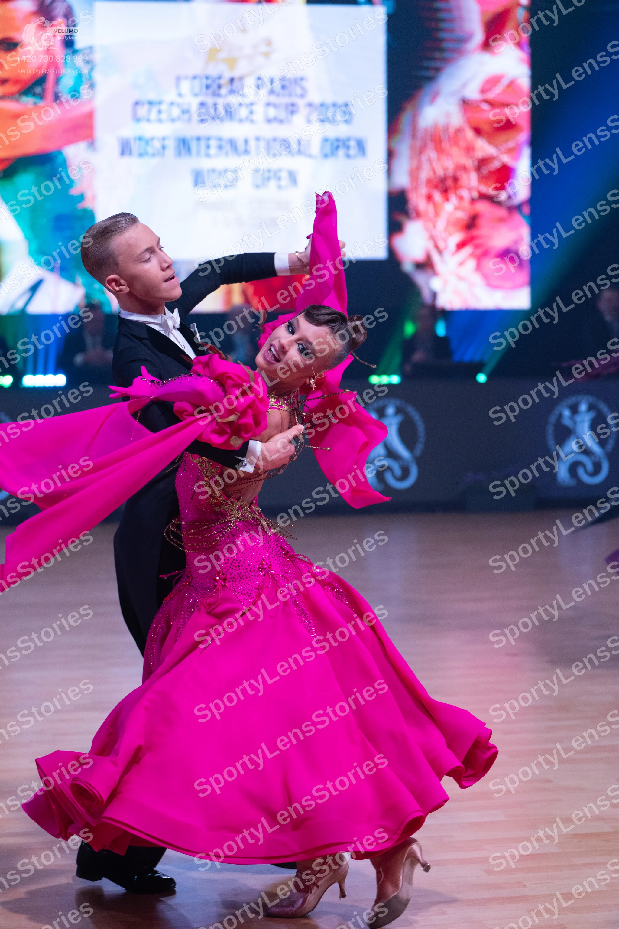 Dancesport competitor: Male dancer: black suit with a white shirt and black bowtie