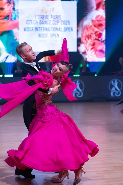Dancesport competitor: Male dancer: black suit with a white shirt and black bowtie