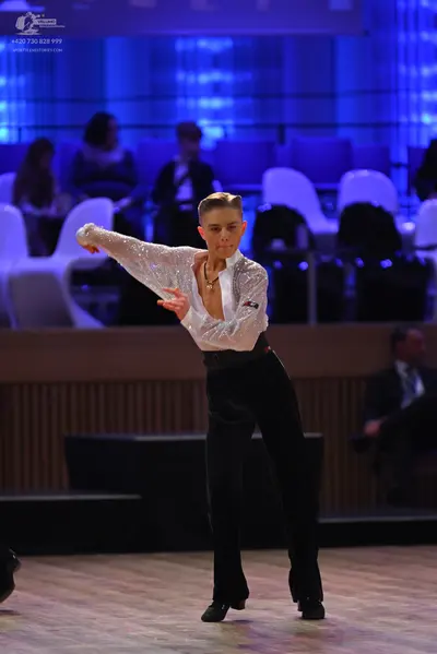 Dancesport competitor: Male dancer: white long-sleeved shirt with fine shimmer/pattern and a deep V-nec
