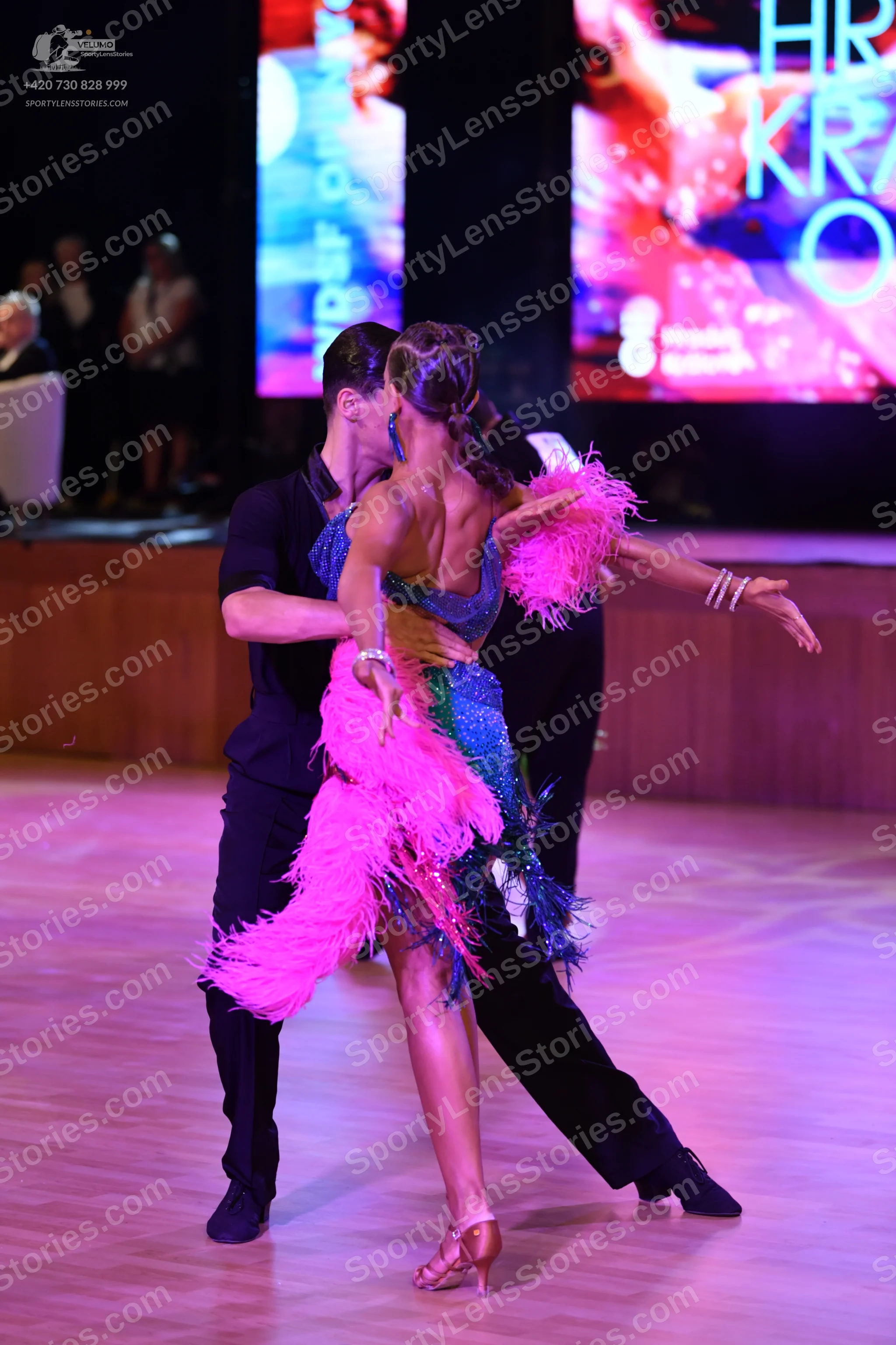 Dancesport competitor: ** Black suit with a satin jacket and trousers