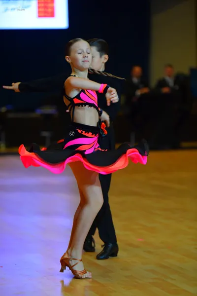 Dancesport competitor: Male dancer: black long-sleeved shirt and trousers