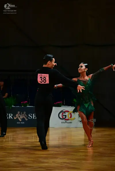 Dancesport competitor #38: Male dancer: black long-sleeved shirt and black trousers