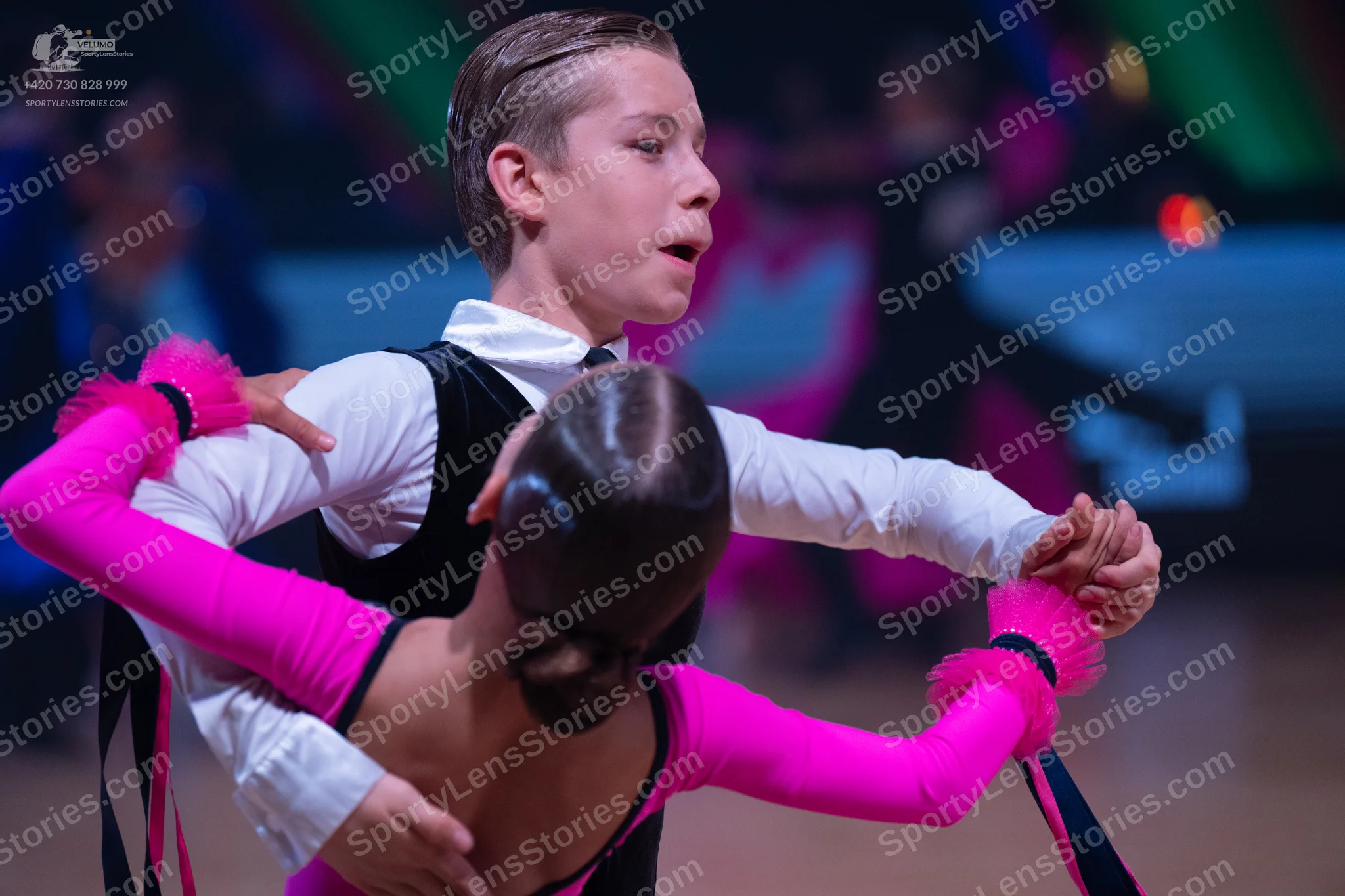 Dancesport competitor: Male dancer: white long-sleeved shirt and black vest
