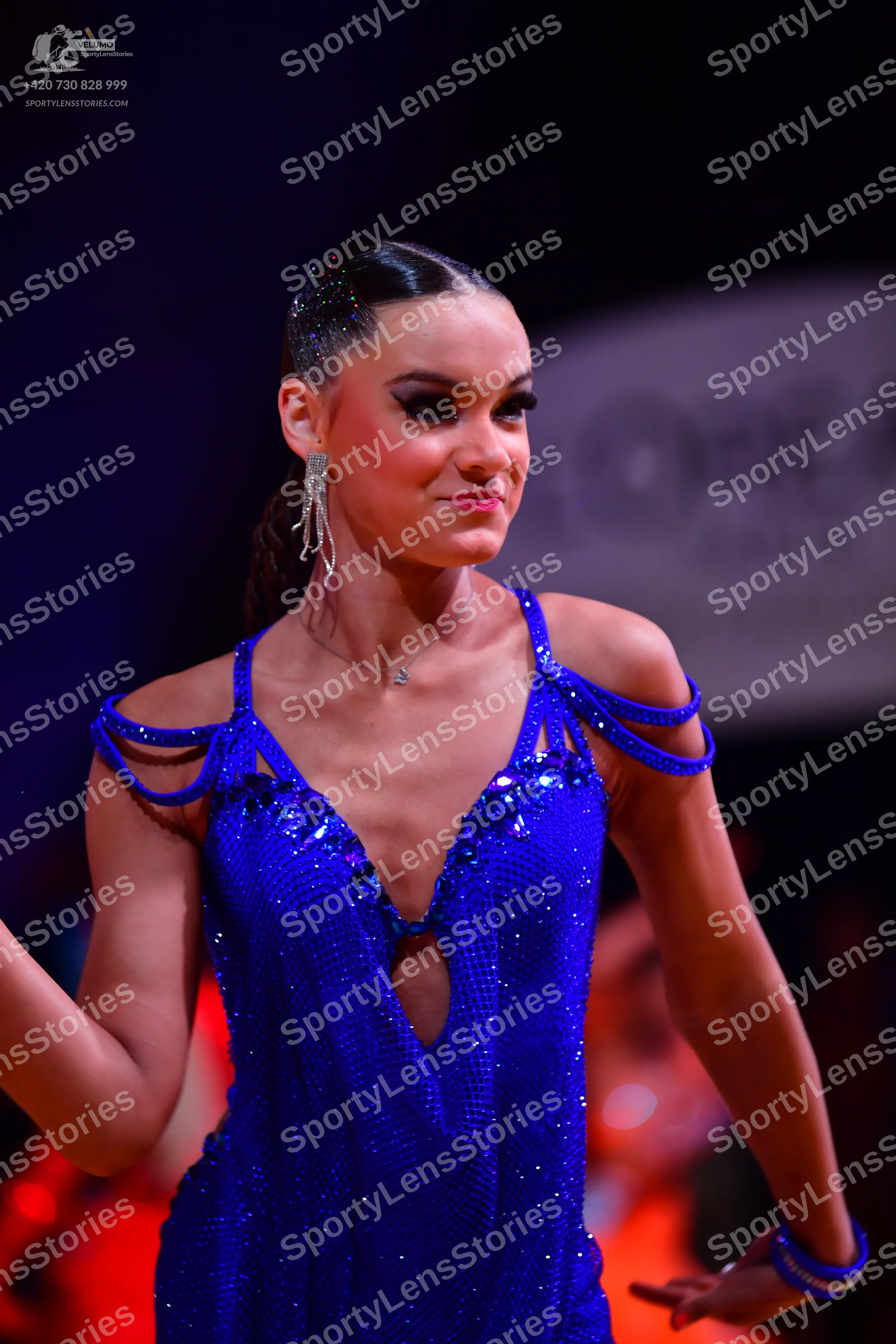 Dancesport competitor: Female dancer: blue sequin latin dress with thin straps