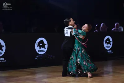 Dancesport competitor: Male dancer: black dance suit