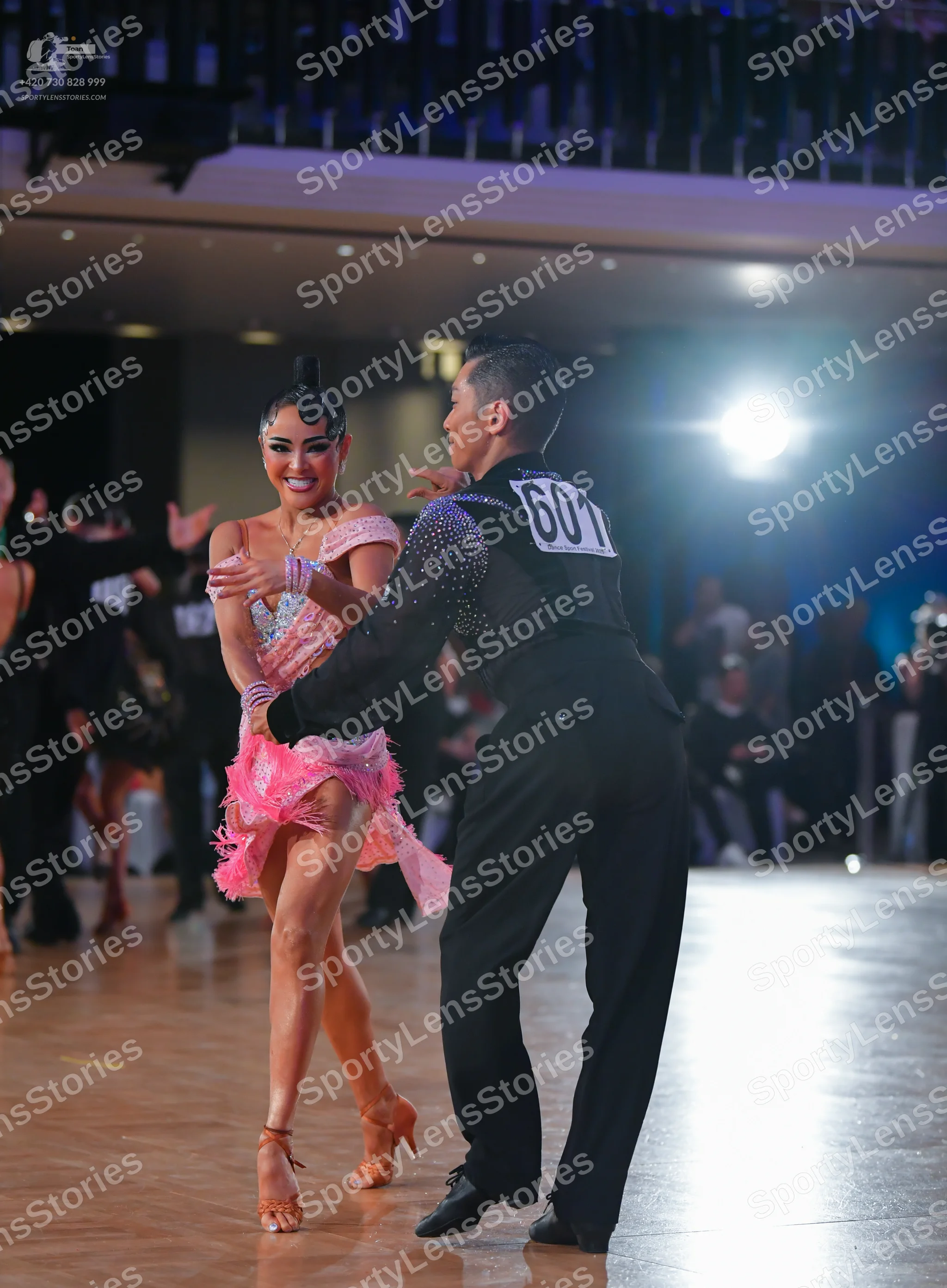 Dancesport competitor #601: Male dancer: black long-sleeved shirt with small sequins and black trousers