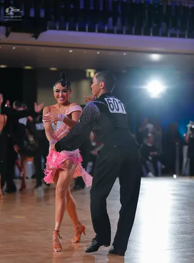Dancesport competitor #601: Male dancer: black long-sleeved shirt with small sequins and black trousers