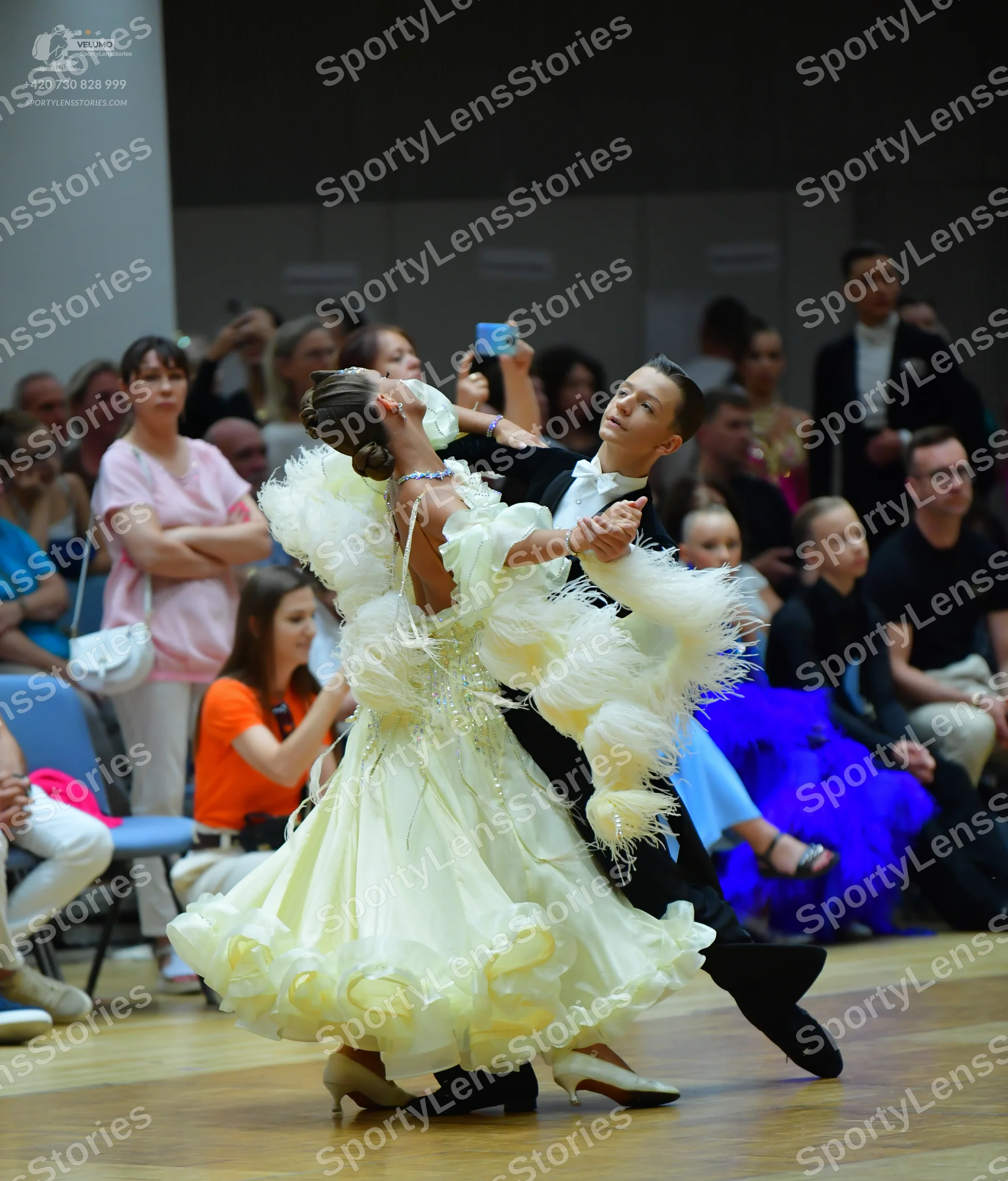 Dancesport competitor: Male dancer: black ballroom suit with a white shirt and white bowtie