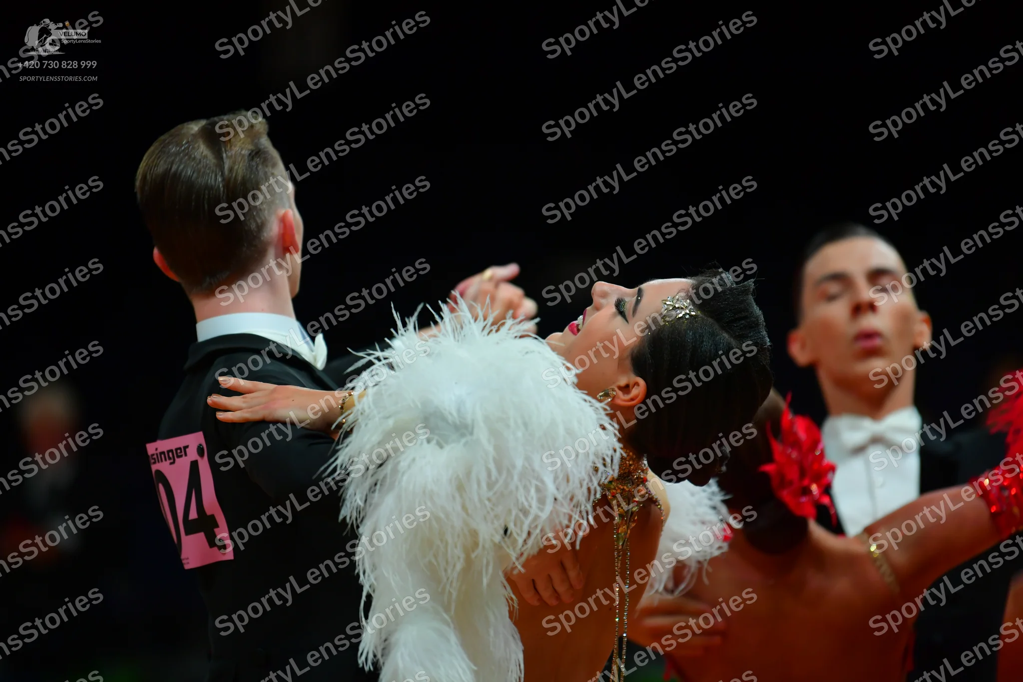 Dancesport competitor: Male dancer: black suit, white shirt, and white bow tie