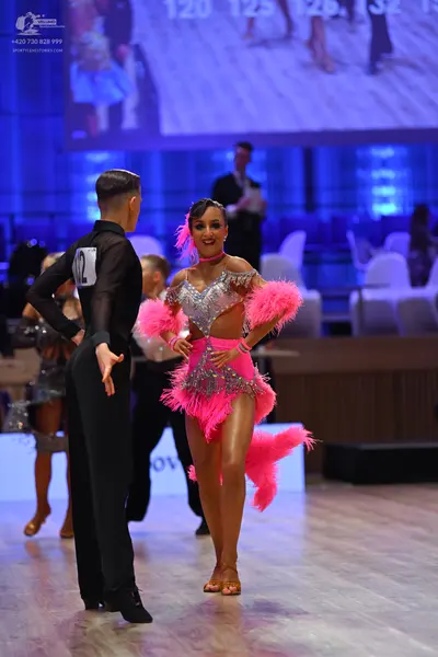 Dancesport competitor: Male dancer: black long-sleeved shirt and black trousers
