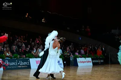 Dancesport competitor: Male dancer: black suit and black dance shoes