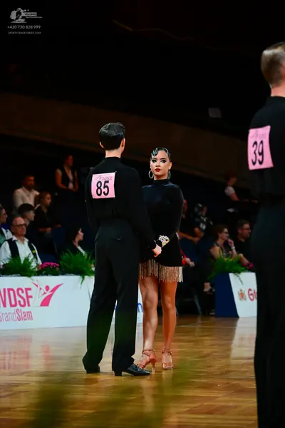 Dancesport competitor #85, #39: Male dancers: black long-sleeved shirts and black trousers