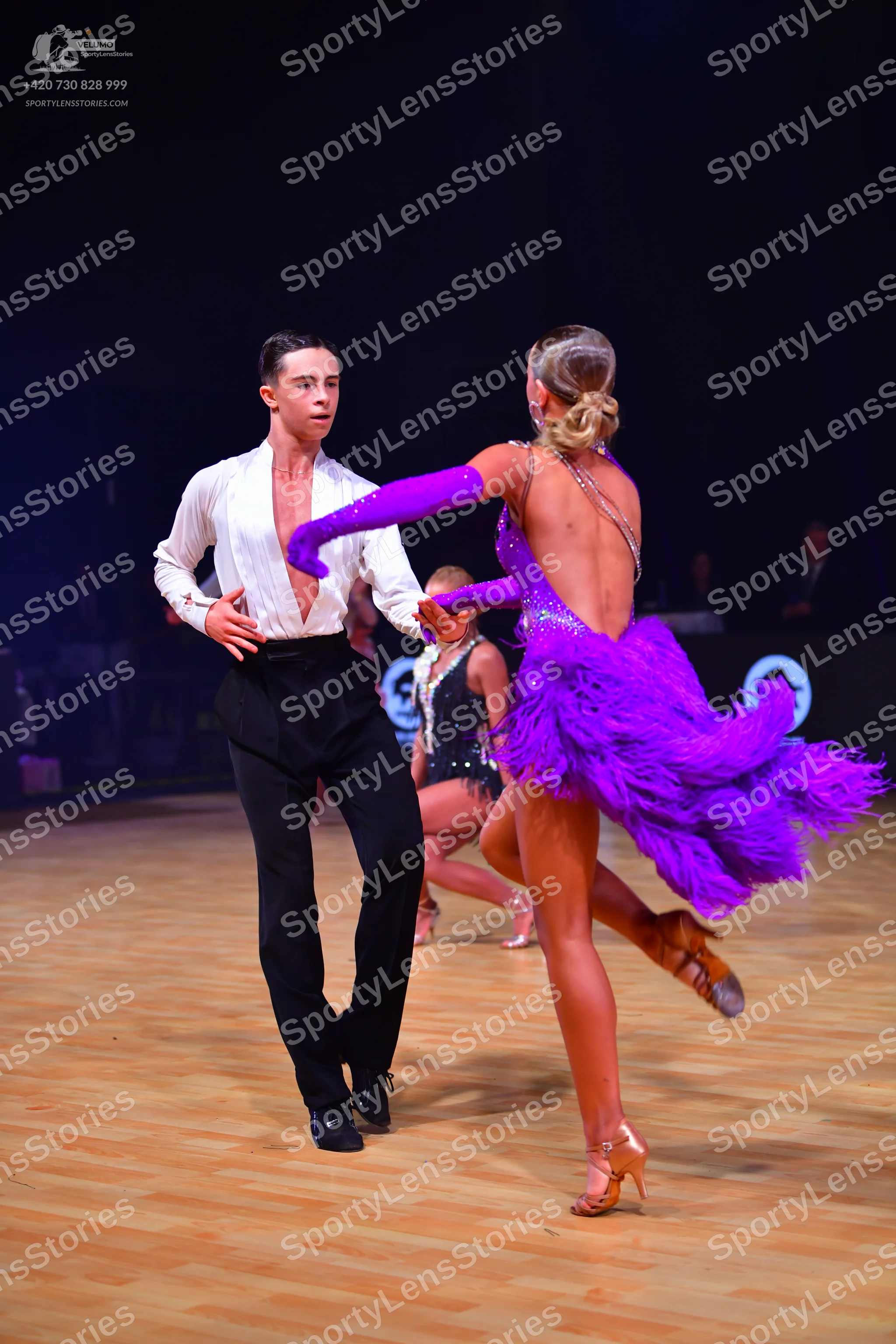 Dancesport competitor: Male dancer: white long-sleeved shirt and black trousers