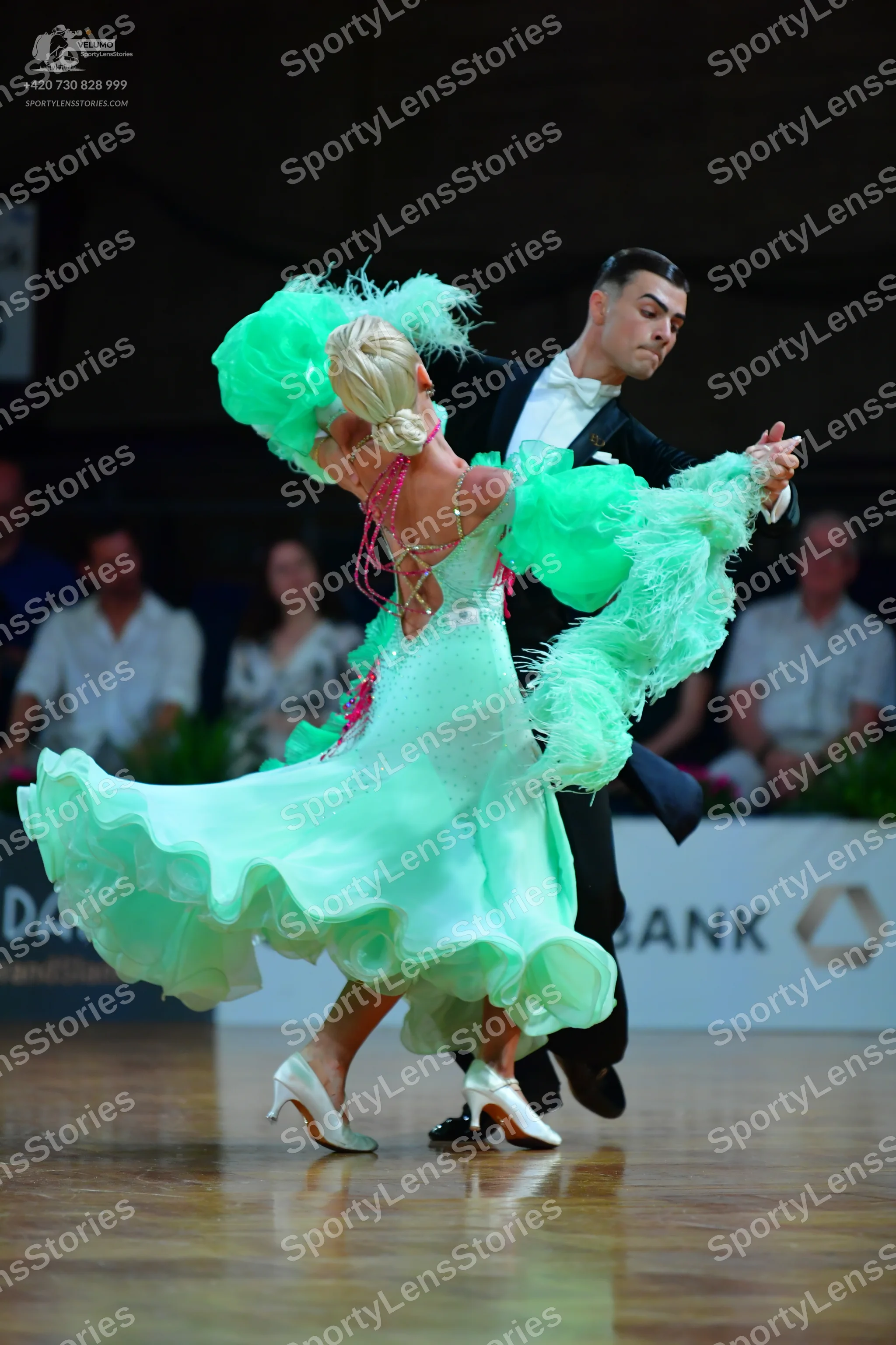 Dancesport competitor: Male dancer: black suit with a white shirt