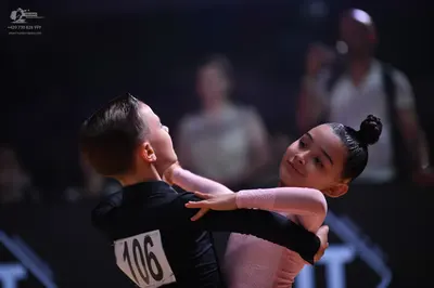 Dancesport competitor: Male dancer: black long-sleeved top