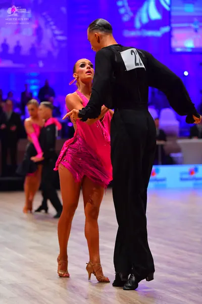 Dancesport competitor: Male dancer: black long-sleeved shirt and black trousers