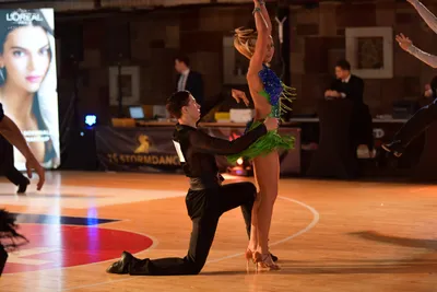 Dancesport competitor: Male dancer: black long-sleeved shirt and black trousers