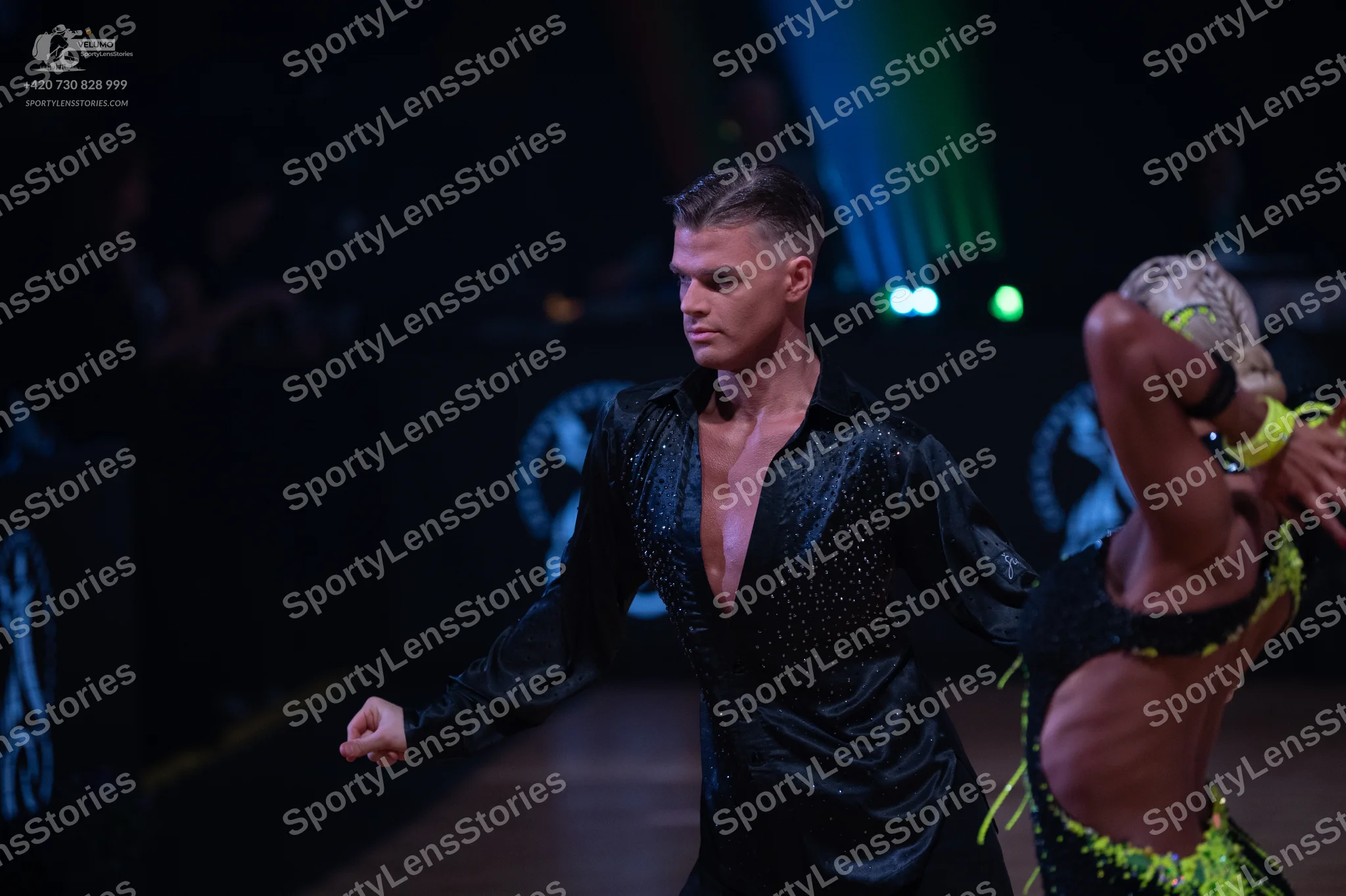 Dancesport competitor: Male dancer: black long-sleeved shirt with a subtle sparkle