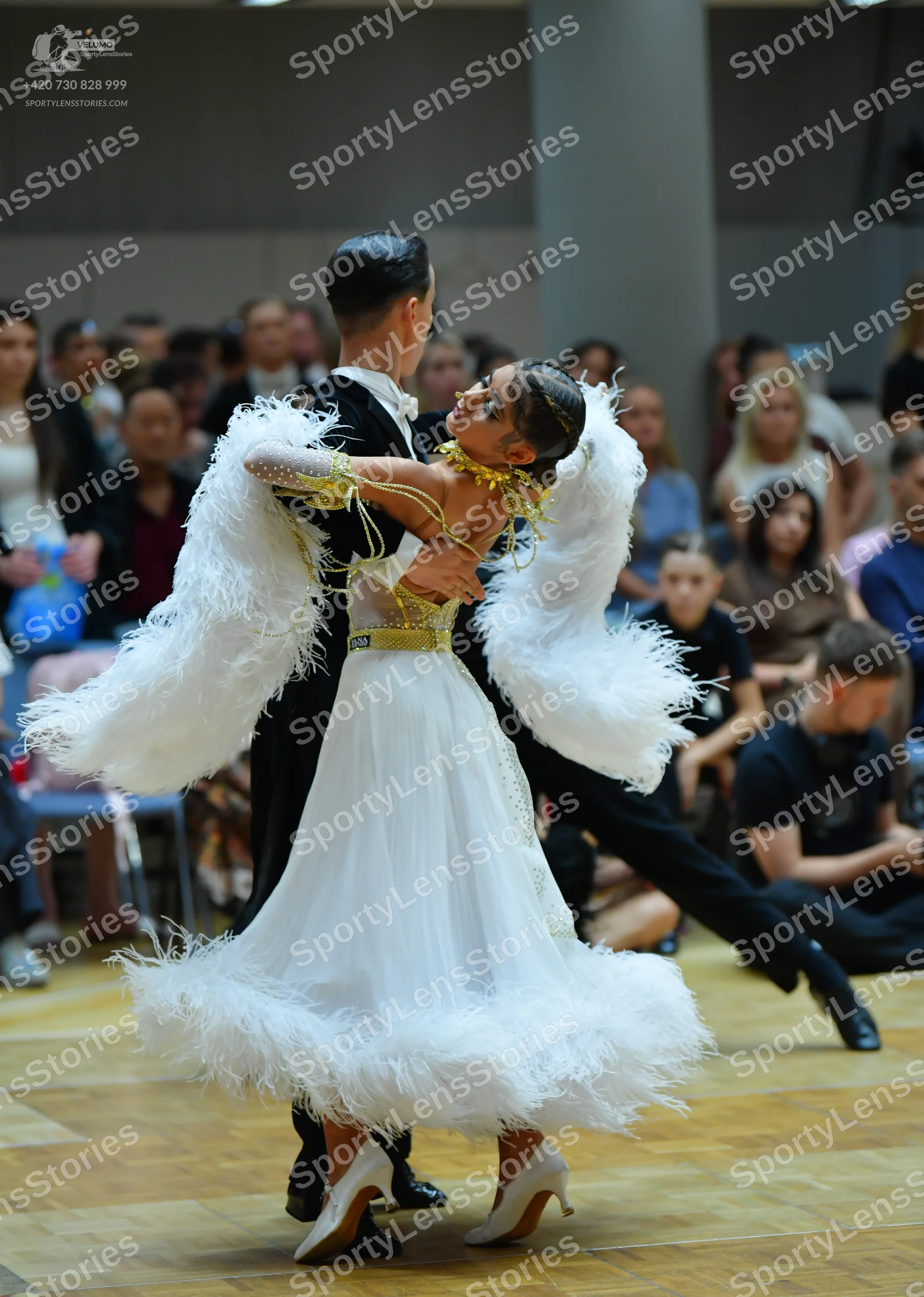 Dancesport competitor: Male dancer: black suit with a white shirt and black trousers