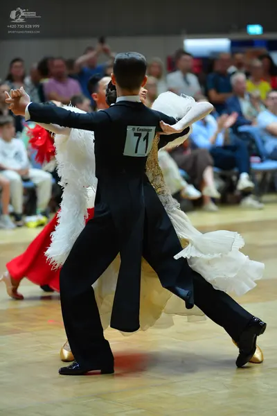 Dancesport competitor #71: Male dancer: black suit and black dance shoes
