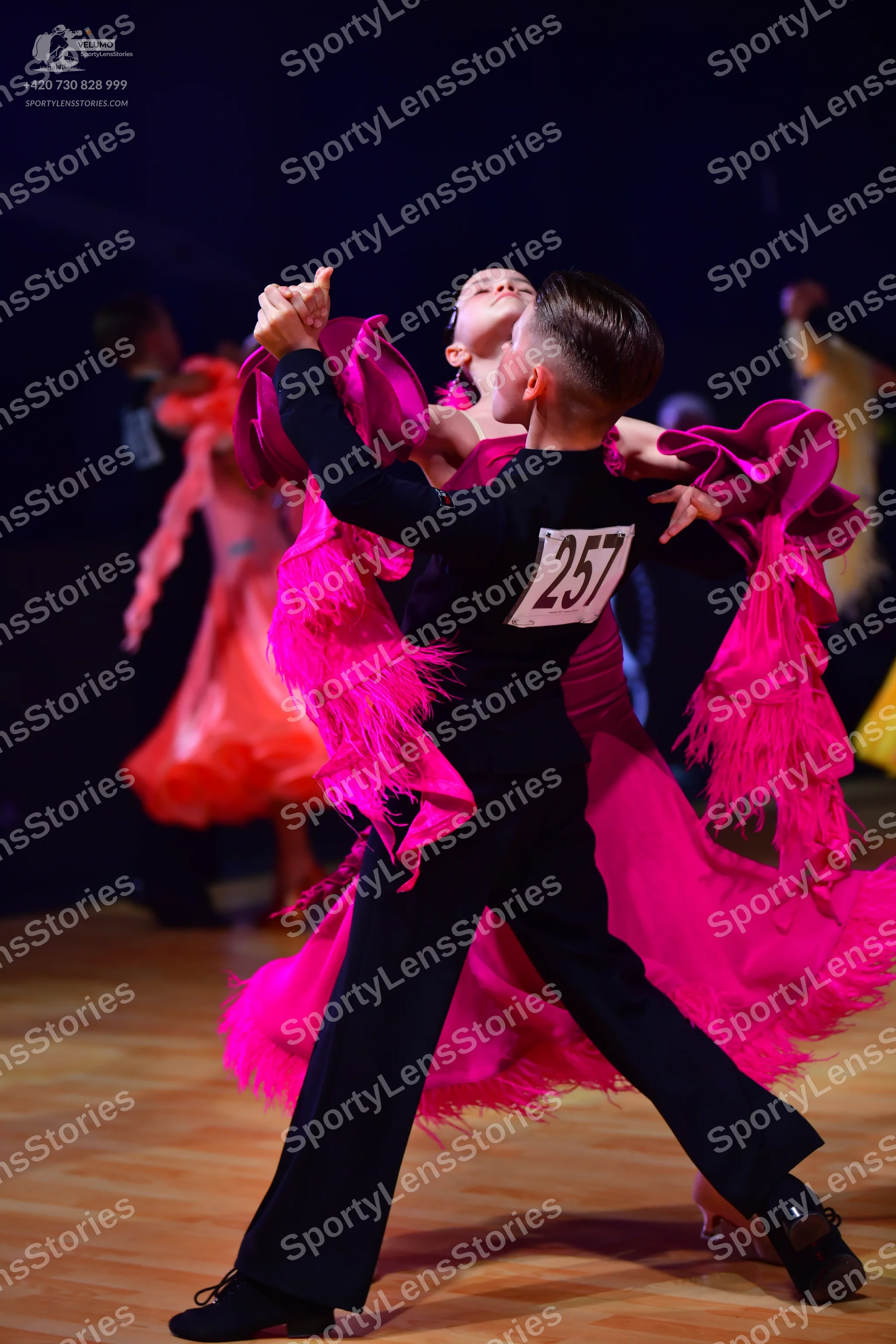 Dancesport competitor: Male dancer: black long-sleeved top and black trousers