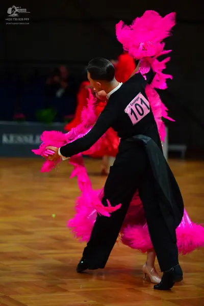 Dancesport competitor: Male dancer: black long-sleeved shirt and black trousers
