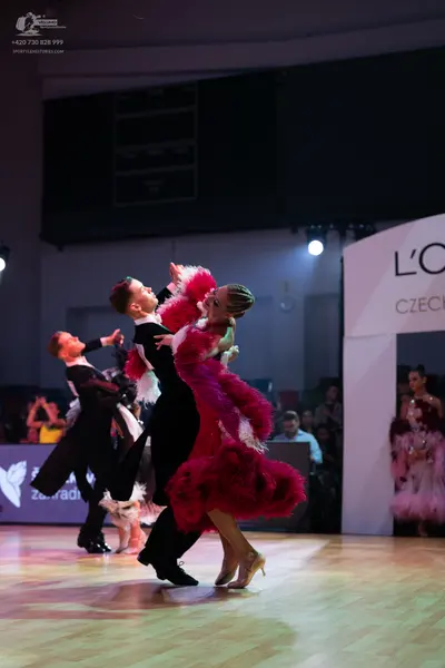 Dancesport competitor: Male dancer: black suit with white shirt