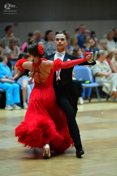 Dancesport competitor: Male dancer: black suit, white shirt, and white bowtie
