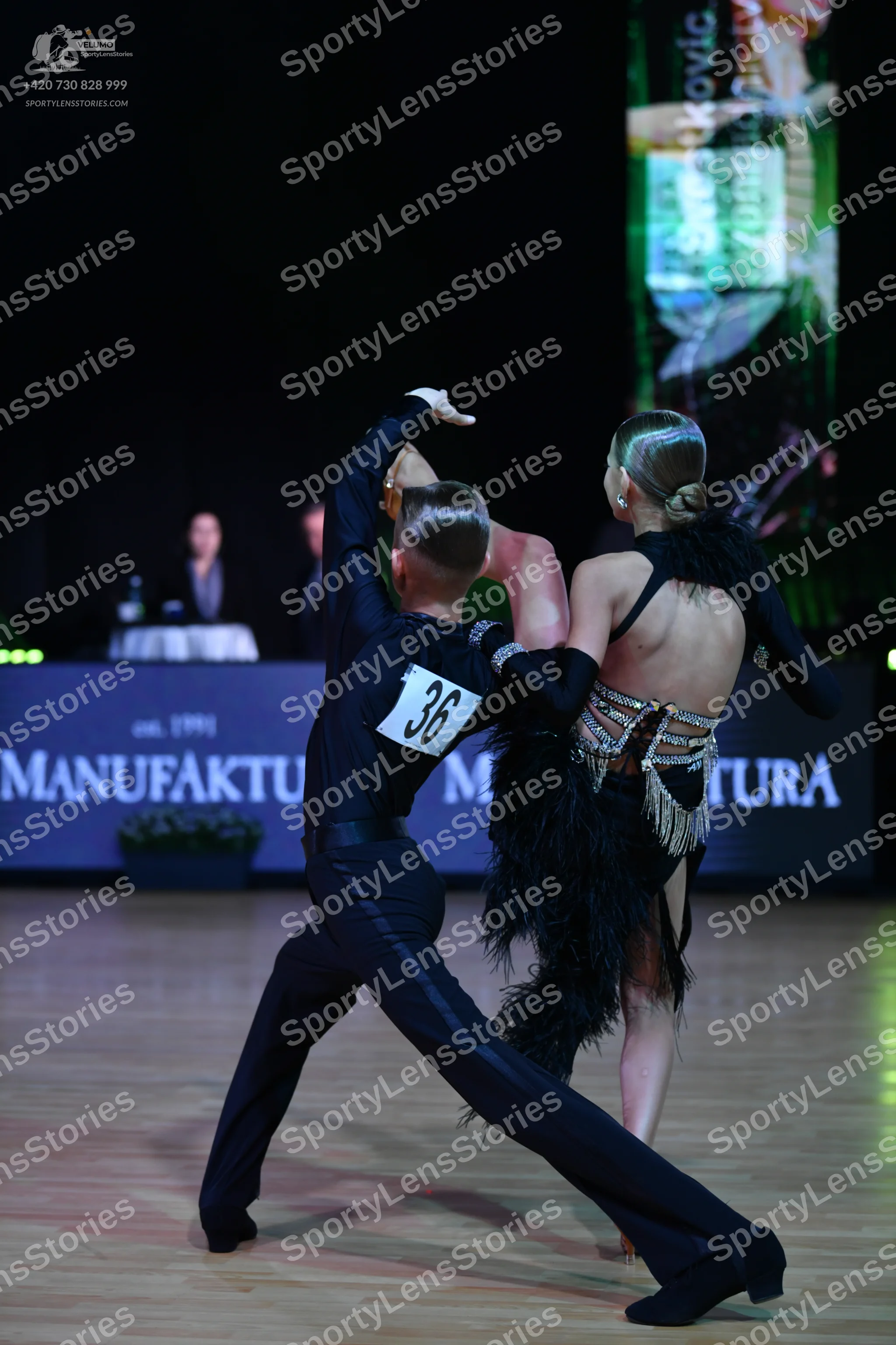 Dancesport competitor: Male dancer: black long-sleeved shirt and black trousers