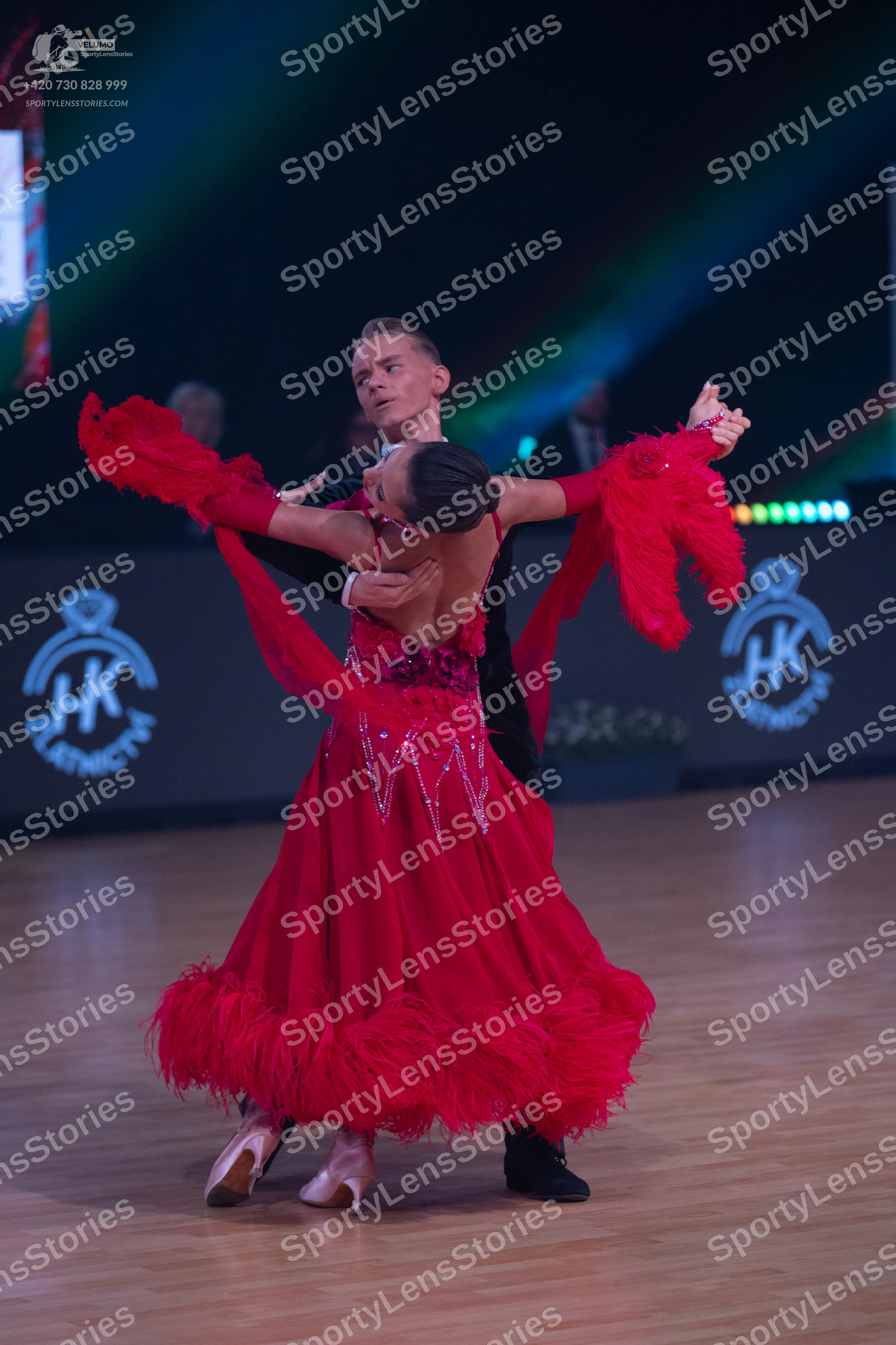 Dancesport competitor: Male dancer: black suit, white shirt, and white bowtie