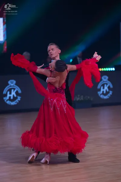 Dancesport competitor: Male dancer: black suit, white shirt, and white bowtie