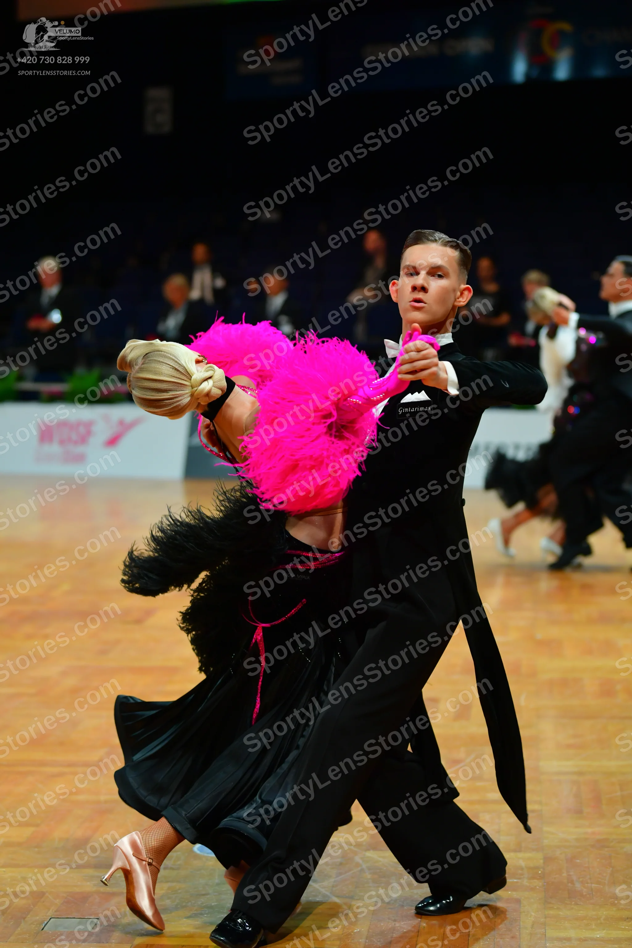 Dancesport competitor: Male dancer: black ballroom tailcoat with satin lapels, white shirt, white bow t