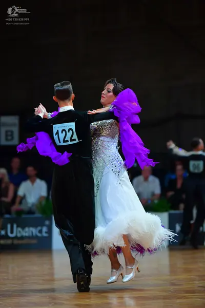Dancesport competitor #122, #96: Male dancer: black long-sleeved shirt and black trousers