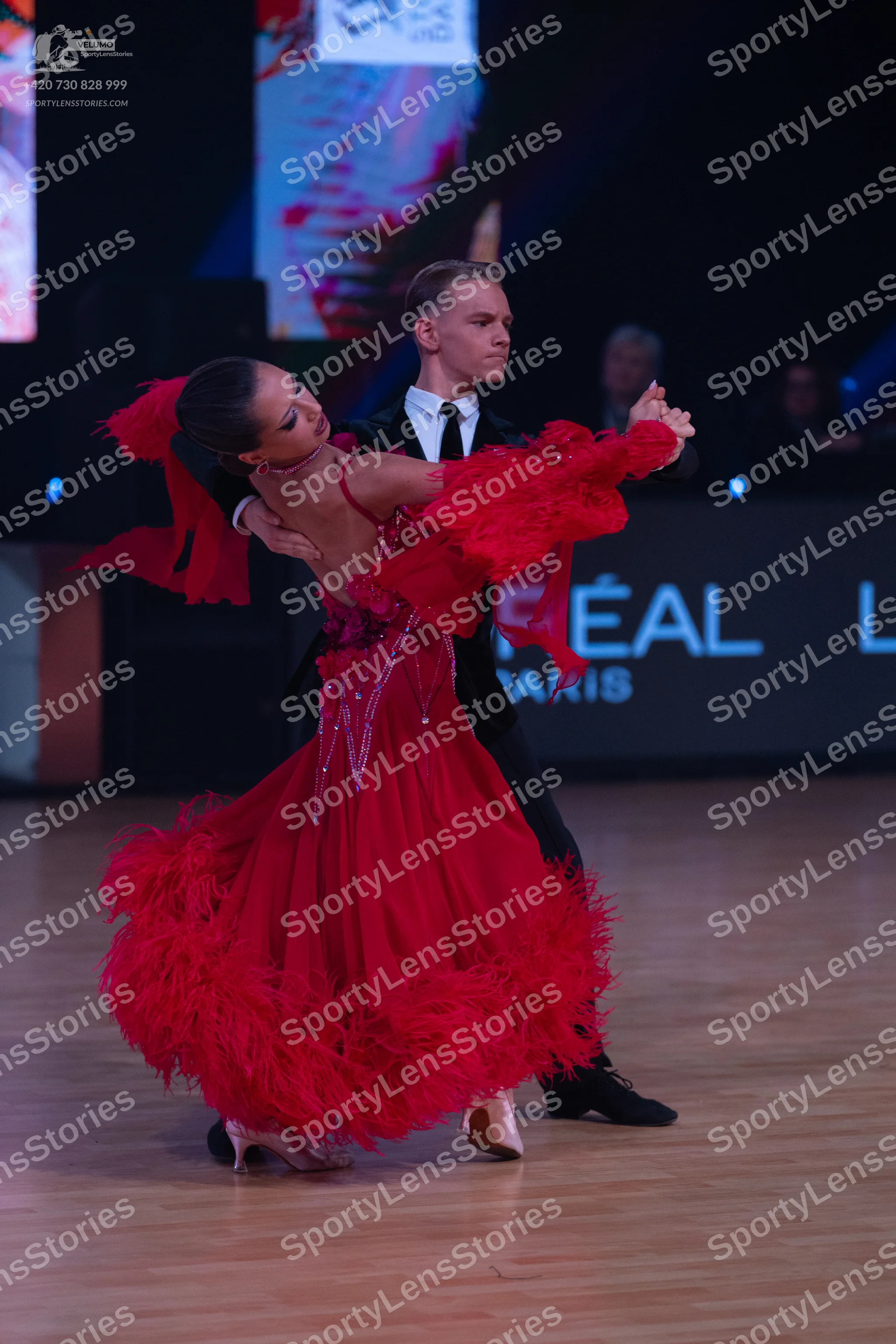 Dancesport competitor: Male dancer: black suit with a white shirt and black tie