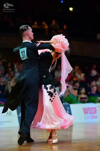 Dancesport competitor #37: Male dancer: black ballroom tailcoat and black dance shoes