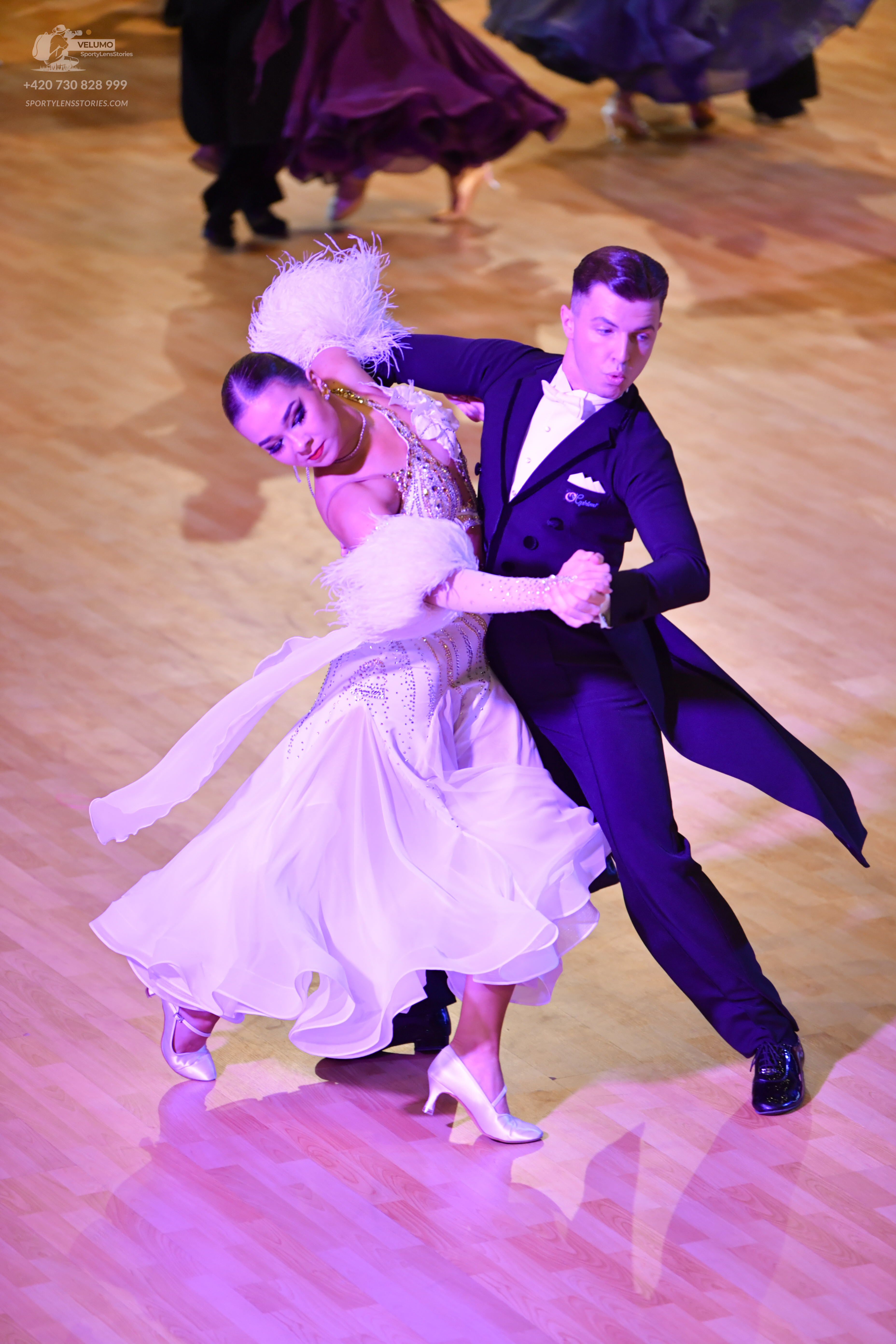 Dancesport competitor: ** Black tailsuit
*   **Fabric:** Satin, with sequin lapels