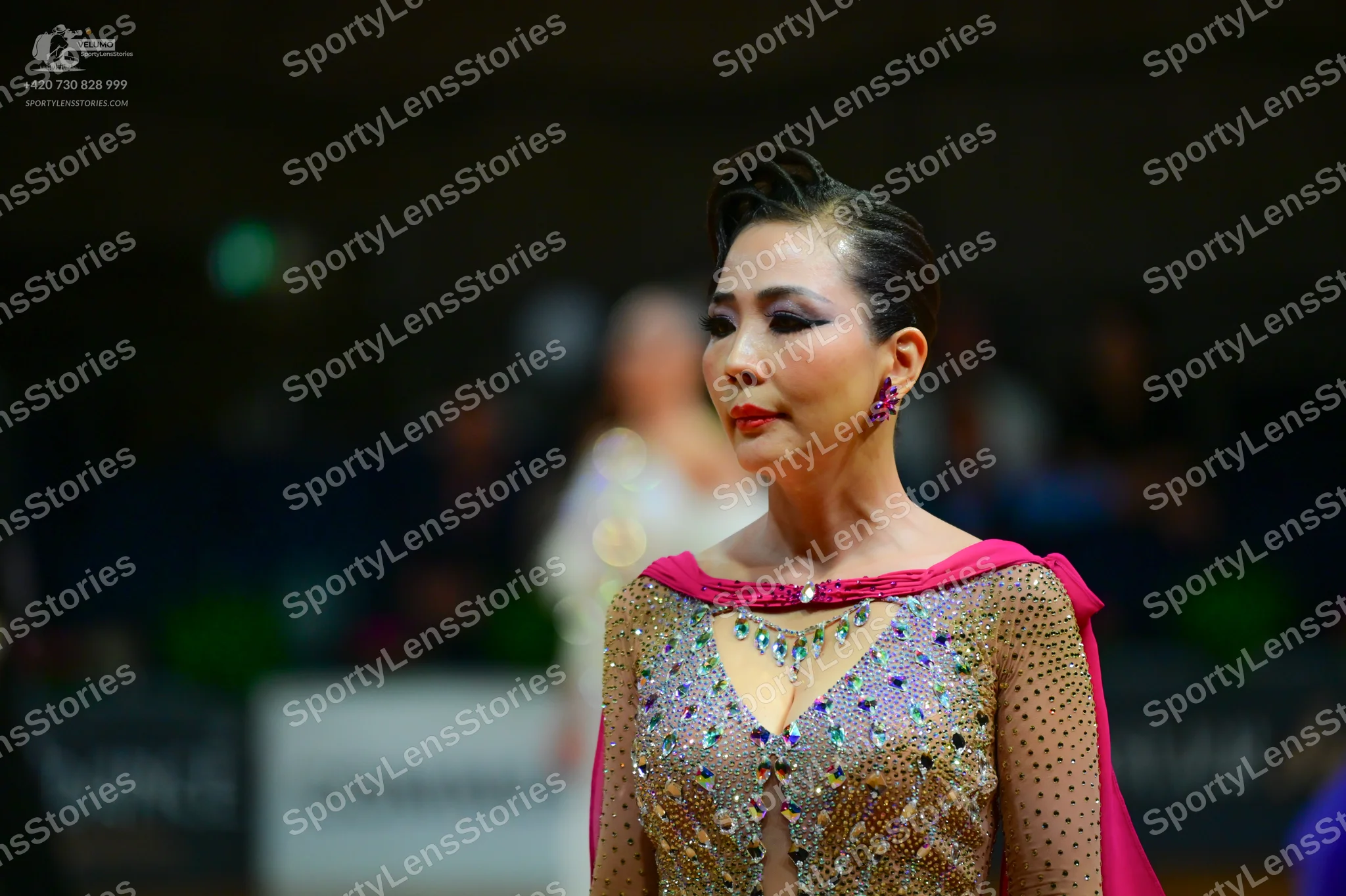 Dancesport competitor: Female dancer: champagne-colored dress with heavy sequin and rhinestone embellis