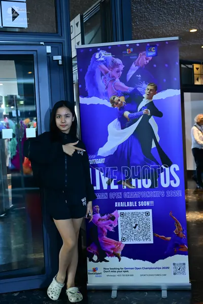 Dancesport competitor: Female dancer: blue ballroom dress