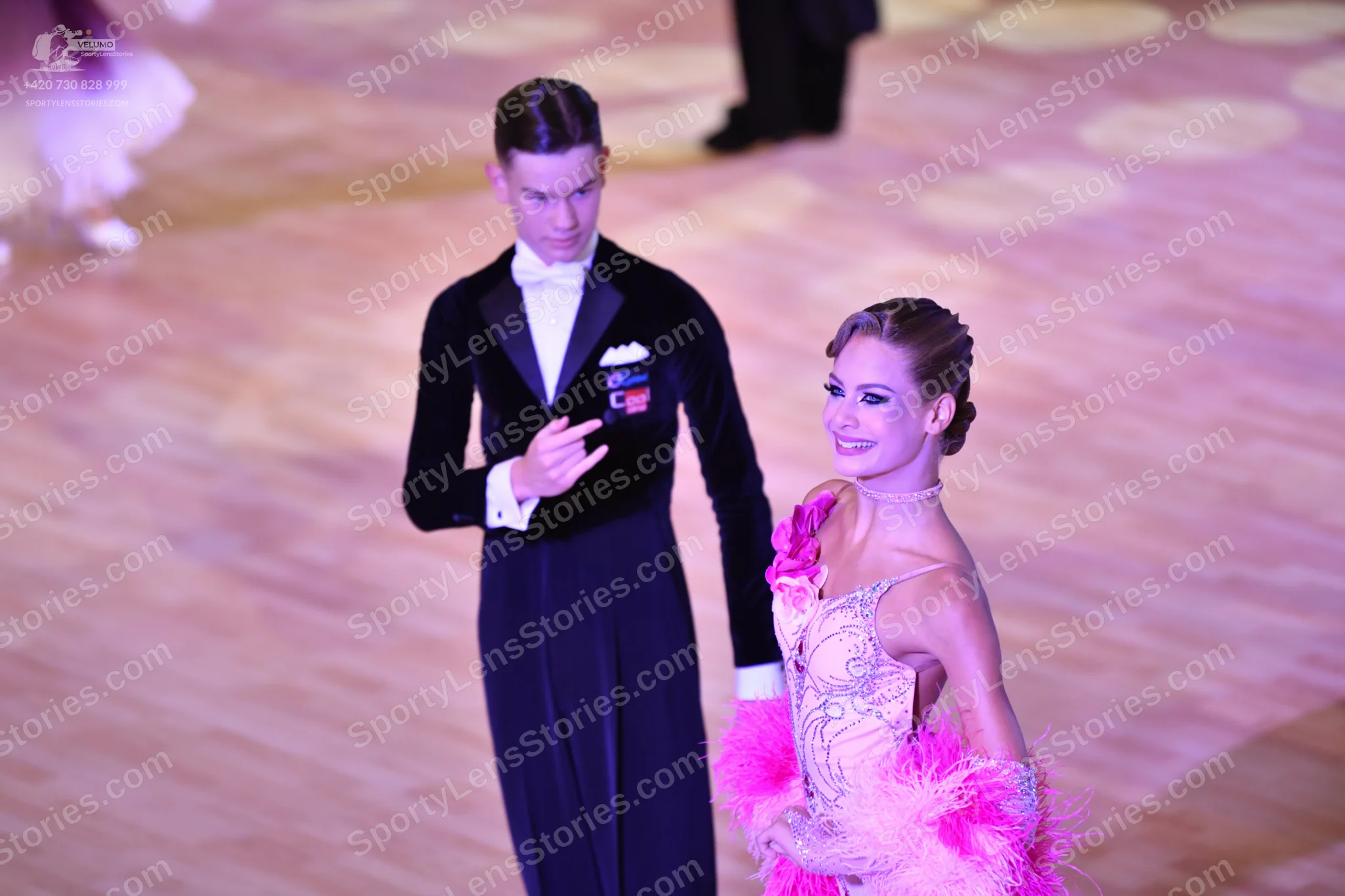 Dancesport competitor: Male**

*   **Color:** Black
*   **Fabric:** Likely satin or a blend with some s