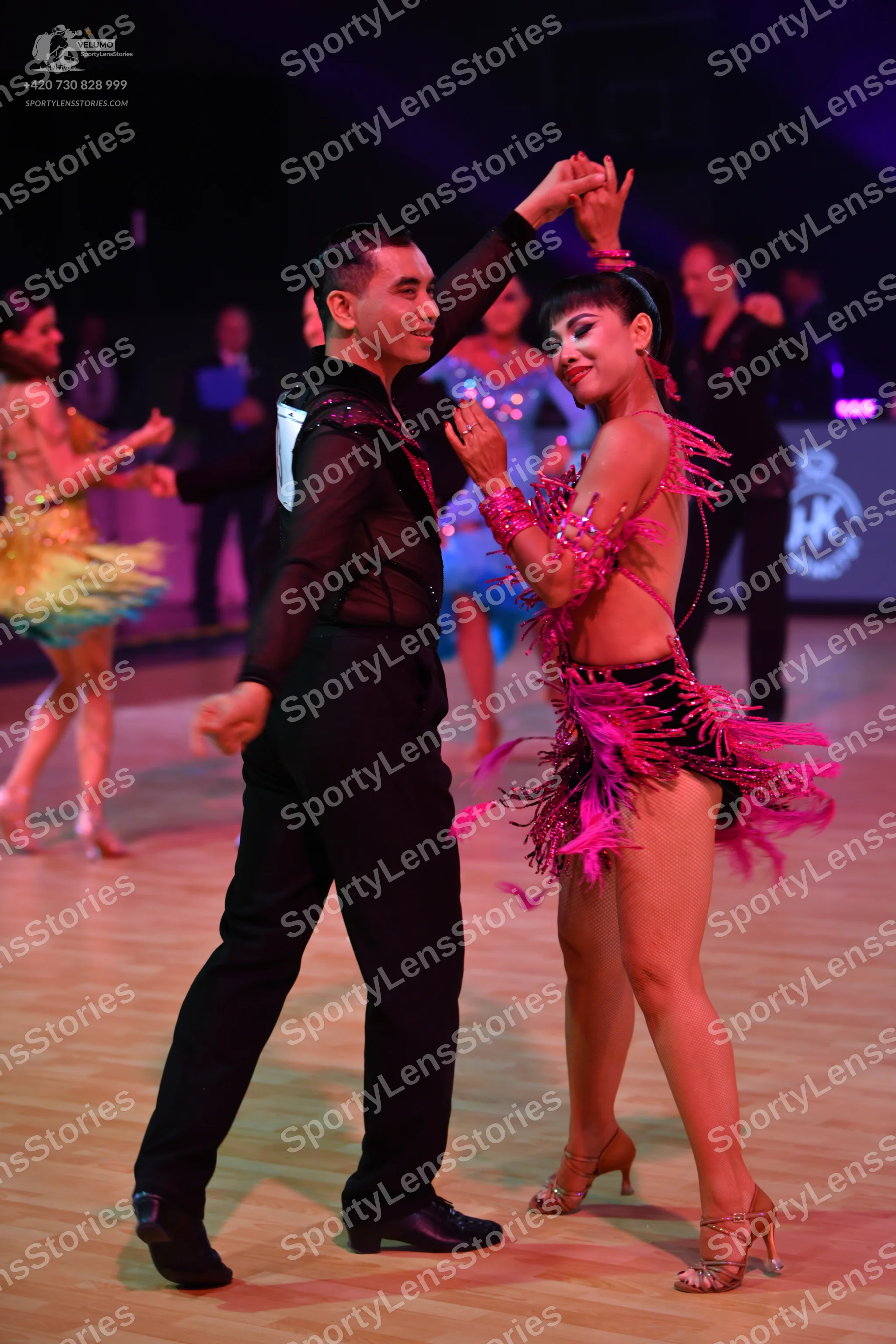 Dancesport competitor: Male dancer: black long-sleeved shirt with sequin details and black trousers