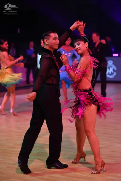 Dancesport competitor: Male dancer: black long-sleeved shirt with sequin details and black trousers